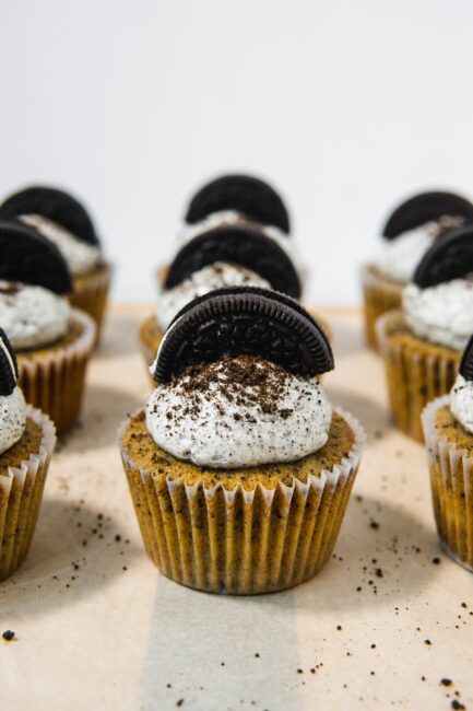 Oreo Cupcakes topped with a mound of cookies and cream Swiss Meringue Buttercream