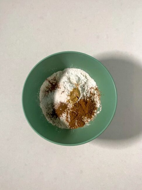 Flour and pumpkin spices in a small bowl