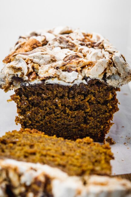 Pumpkin spice tea cake with marbled meringue topping. Cut. 
