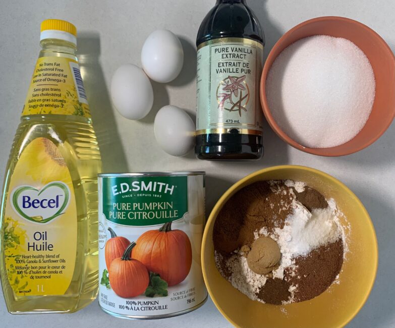 Ingredients to make Pumpkin Spice Tea Cake - pumpkin puree, flour, pumpkin pie spices, oil, sugar, eggs, vanilla extract