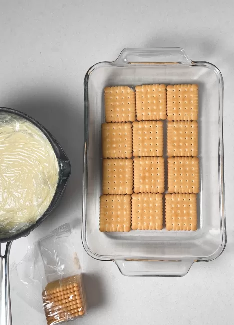 biscuit cookies in a pan with custard to the side 