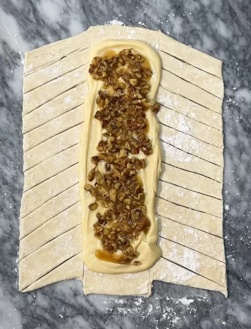 cream cheese and maple pecan filling layered on puff pastry