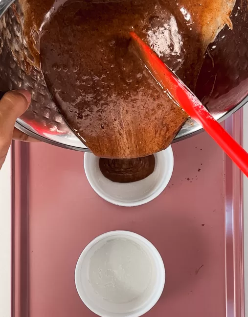 pouring Chocolate Lava Cakes batter into ramekins 
