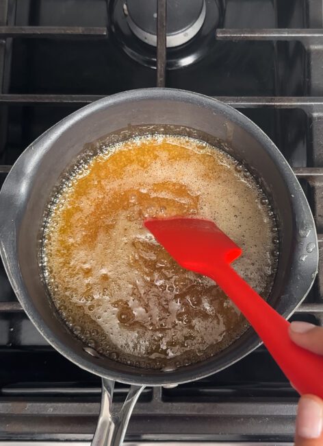 heated butter and sugar on a stove