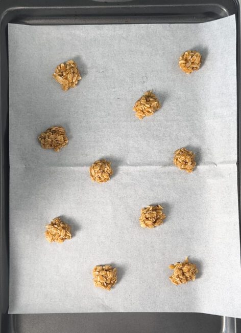 Oatmeal Lace cookies dough in balls on a baking sheet