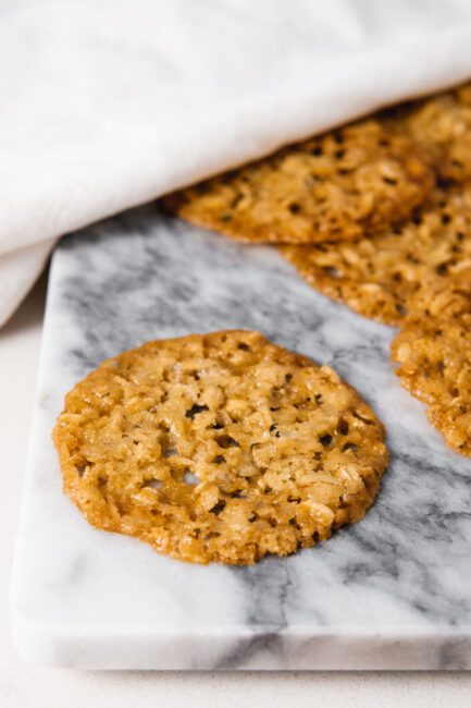 Oatmeal Lace cookies on a marble slab