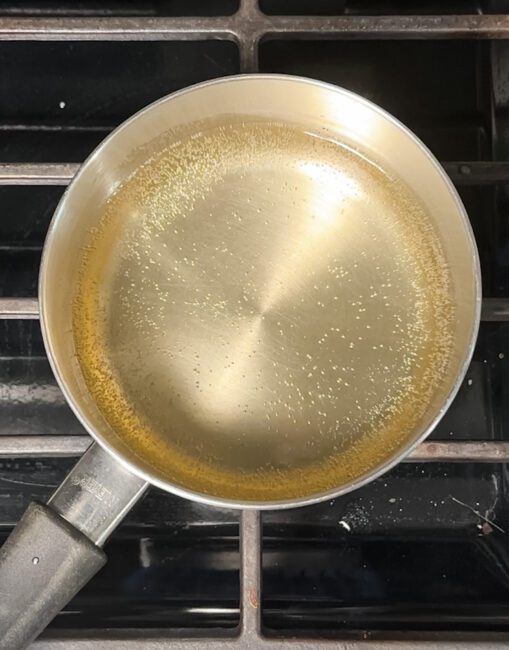 heating champagne in sauce pan