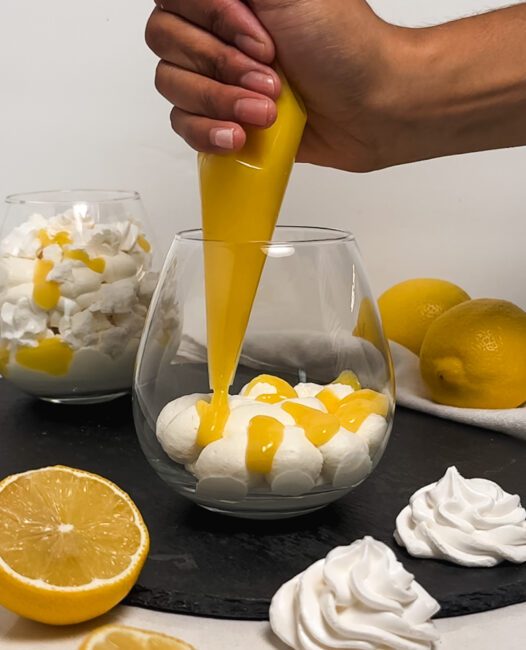 pipping lemon meringue in a cup