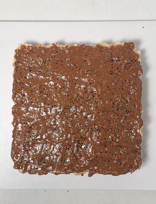 sprinkles added to Rice Krispie Treats with melted chocolate 
