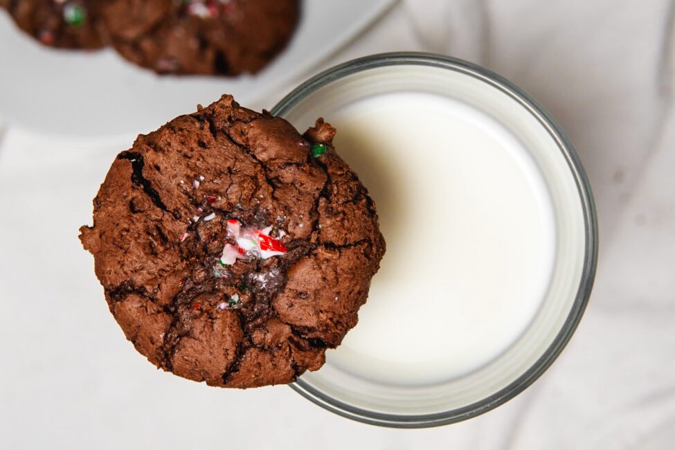 Peppermint Brownie Cookie on top of a glass of milk
