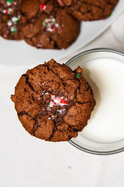 top down view of a Peppermint Brownie Cookie on top of a glass of milk
